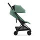 Детская коляска Cybex Coya Matt Black Leaf green с дождевиком и бампером